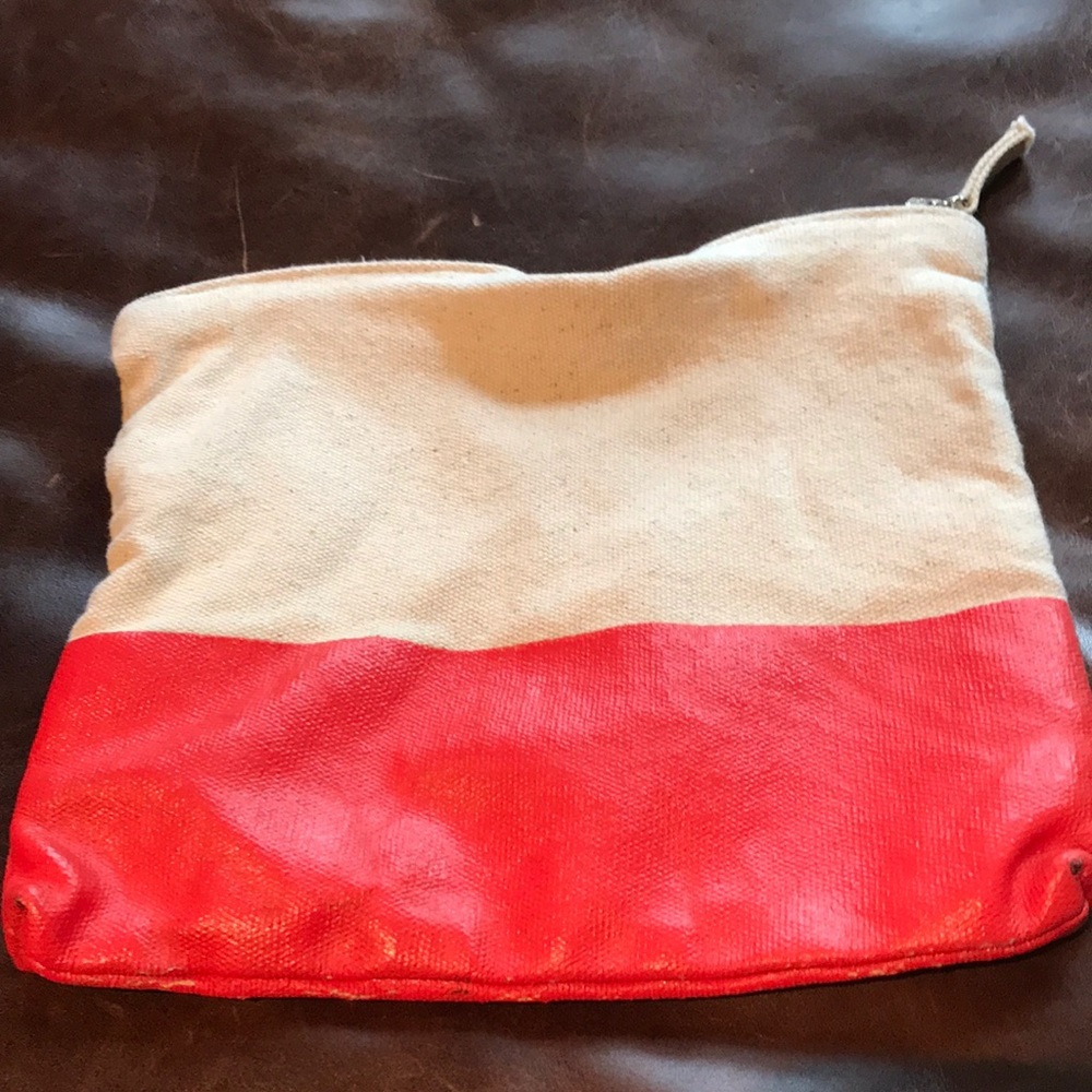 Cosmetic or pencil bag with vinyl orange bottom